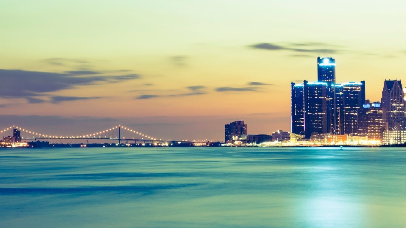Detroit skyline and river at night