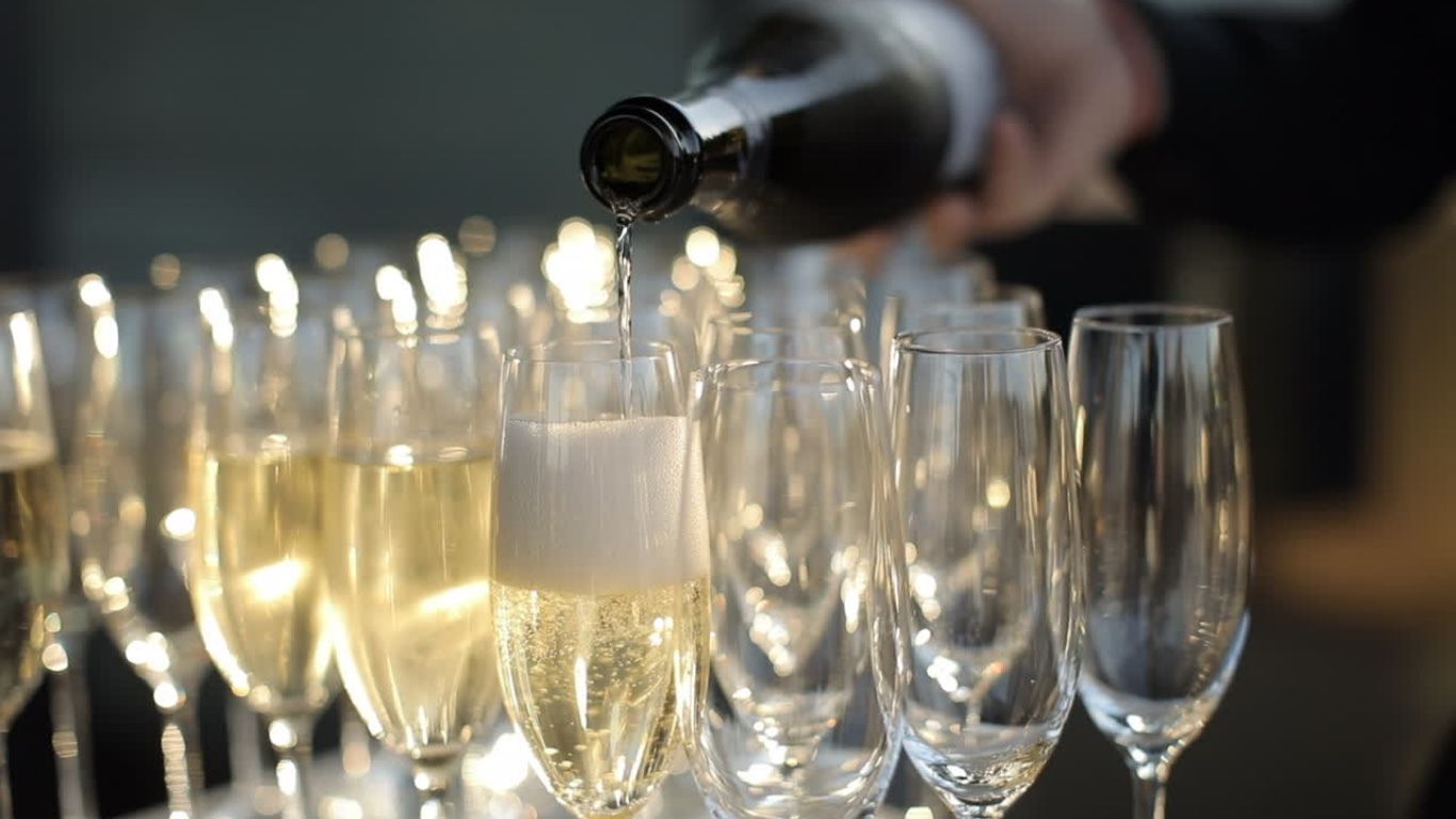Champagne being poured into flutes